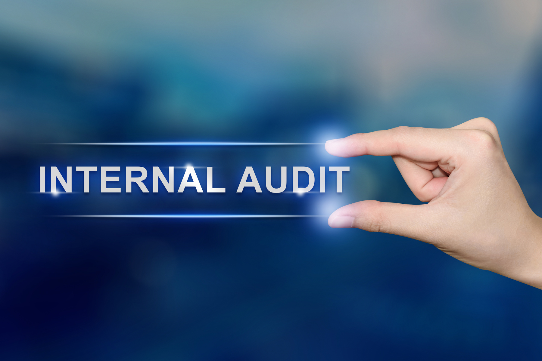 hand clicking internal audit button